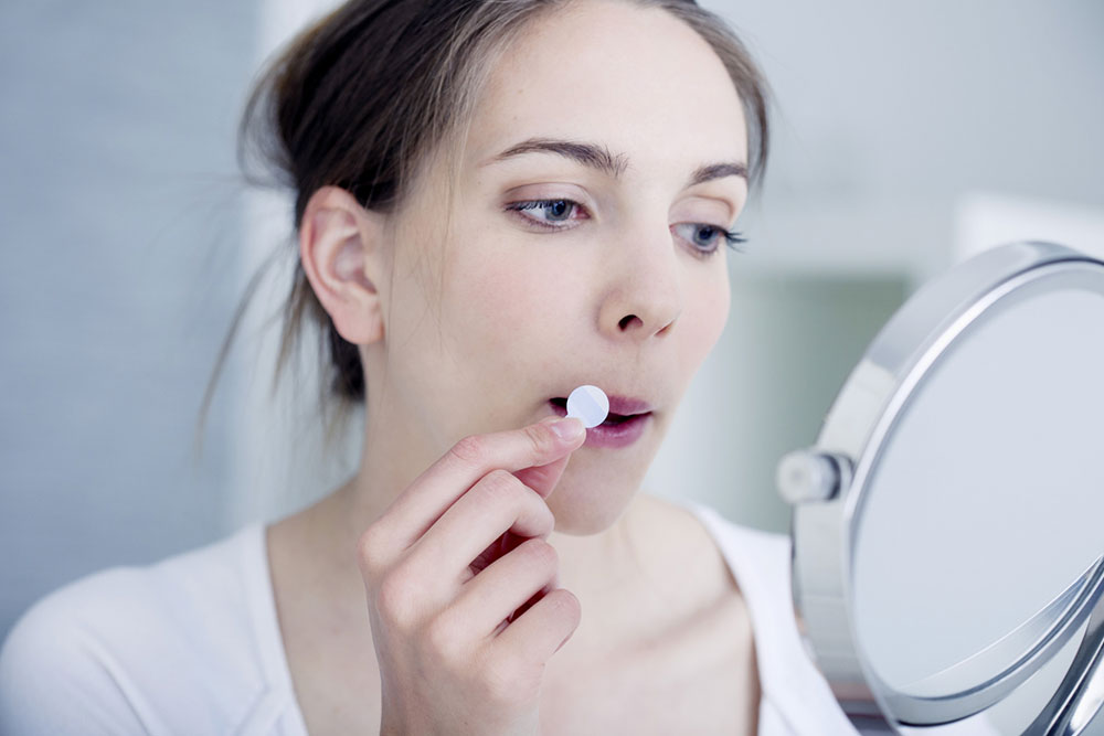 Treatment of symptoms of herpes